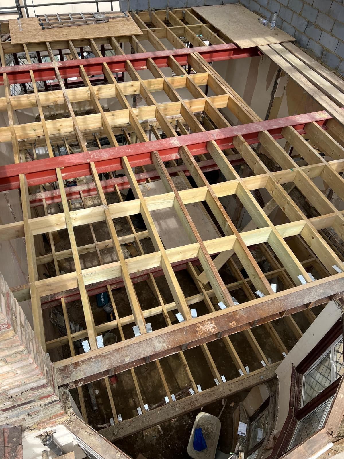 New loft floor in timber joists and steel beams, seen from above
