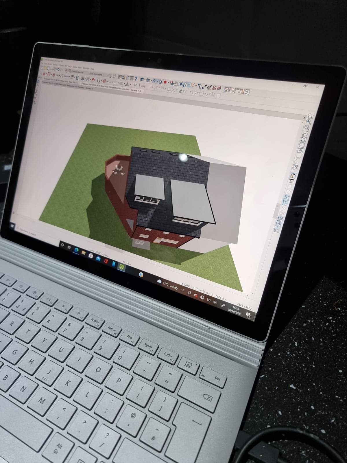 3D model of the house on a laptop, used to plan the build