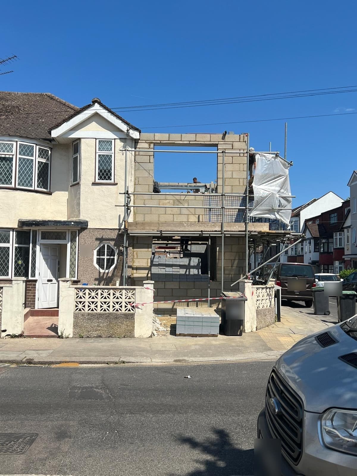 Two-storey side extension in blockwork beside the existing semi-detached house